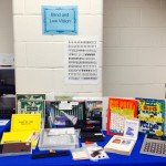 Blind and low vision table with writing guides, large print activity books, talking calculator and more